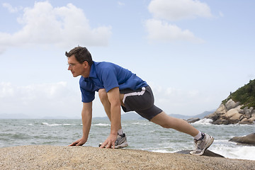 Image showing Jogger doing fitness exercises