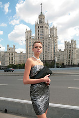 Image showing serious girl with hand-bag