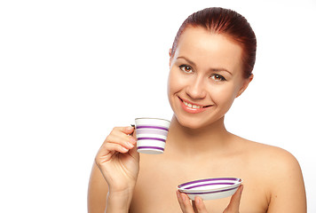 Image showing smiling young woman with coffee cup