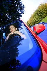 Image showing beautiful woman in car