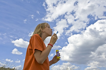 Image showing Childrem blowing bubbles