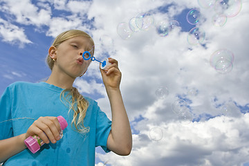 Image showing Childrem blowing bubbles