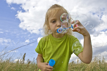 Image showing Childrem blowing bubbles