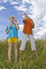 Image showing Childrem blowing bubbles