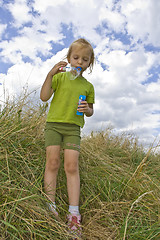 Image showing Childrem blowing bubbles