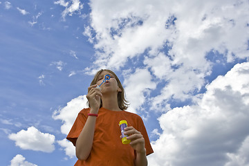 Image showing Childrem blowing bubbles