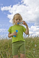 Image showing Childrem blowing bubbles