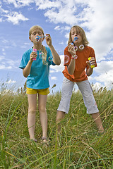 Image showing Childrem blowing bubbles