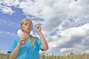 Image showing Childrem blowing bubbles
