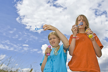 Image showing Childrem blowing bubbles