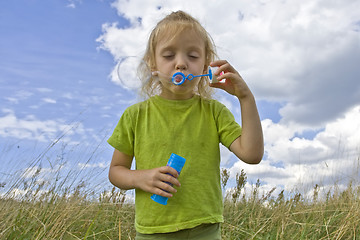 Image showing Childrem blowing bubbles