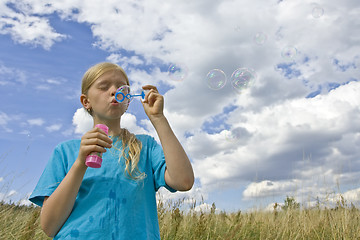 Image showing Childrem blowing bubbles