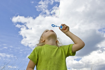 Image showing Childrem blowing bubbles