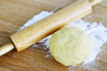 Image showing Rolling pin and cookie dough