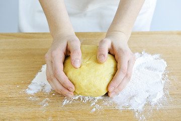 Image showing Hands kneading dough