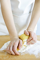 Image showing Hands kneading dough