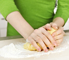 Image showing Hands kneading dough