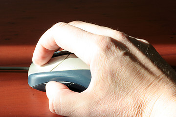 Image showing computer mouse in hand businessperson