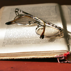 Image showing aging book and spectacles for correcting the vision