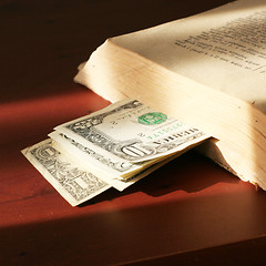 Image showing old paper bills and aging book