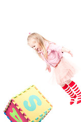 Image showing Little girl playing with cube