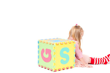 Image showing Little girl playing with cube