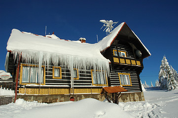 Image showing snowy cottage