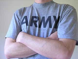 Image showing Man in army t-shirt, arms crossed