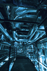 Image showing Equipment, cables and piping as found inside of a modern industr