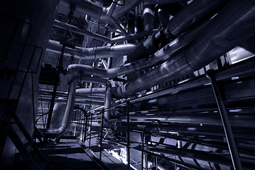 Image showing Equipment, cables and piping as found inside of a modern industr