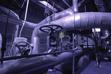 Image showing Equipment, cables and piping as found inside of a modern industr