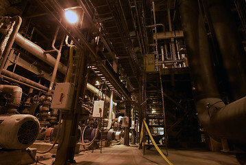 Image showing Pipes, tubes, machinery and steam turbine at a power plant