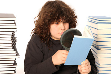 Image showing boy reading a book with lens