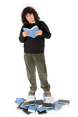 Image showing boy on stack of books