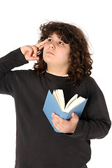 Image showing boy thinking and reading a book 