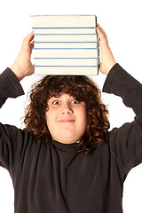 Image showing boy with books on head