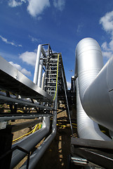 Image showing  Pipes, tubes, machinery and steam turbine at a power plant