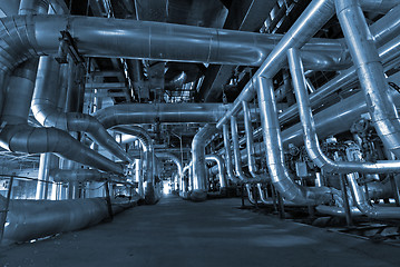 Image showing Equipment, cables and piping as found inside of a modern industr