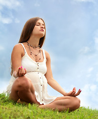 Image showing expectant mother is meditating