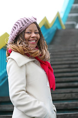 Image showing smiling african girl with red scarf