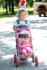 Image showing little girl walks with sidercar