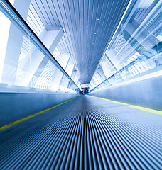 Image showing moving blue escalator