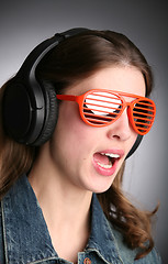 Image showing singing girl in headphones