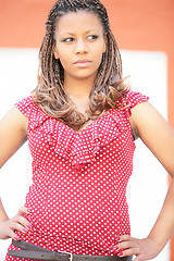 Image showing African girl in red polka dress