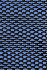 Image showing Metal grid over blue background