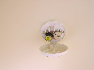 Image showing Smoke detector rendered useless with battery.