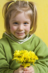 Image showing Girl and yellow flowers
