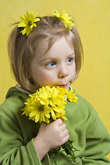 Image showing Girl and yellow flowers