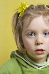 Image showing Girl and yellow flowers