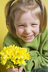 Image showing Girl and yellow flowers